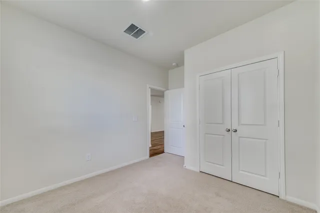 a bathroom with a sink a toilet a mirror a bathtub and shower