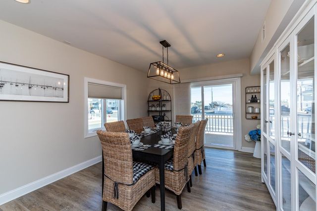 a dining room with furniture window wooden floor