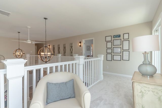 a bedroom with furniture and a chandelier