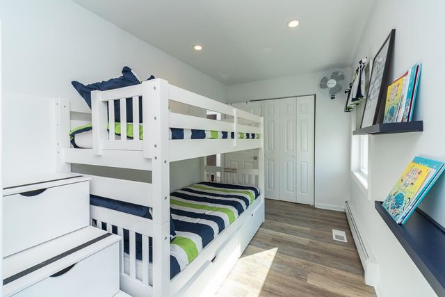 a bedroom with furniture and a window