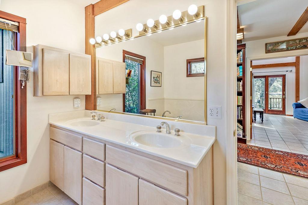 2076 Upper Applegate Road Jacksonville, OR 97530 - Photo 23 of 35 a bathroom with a sink and a mirror