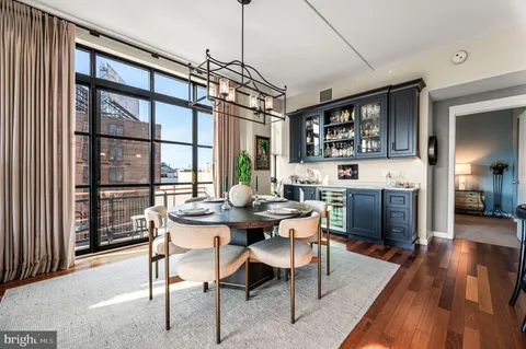 a view of a dining room with furniture window and wooden floor