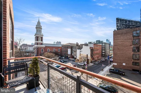 a view of a city skyline from a balcony
