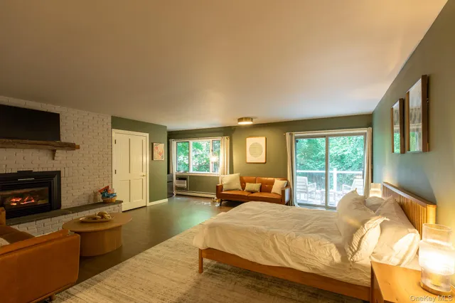 a bed room with a bed and a couch