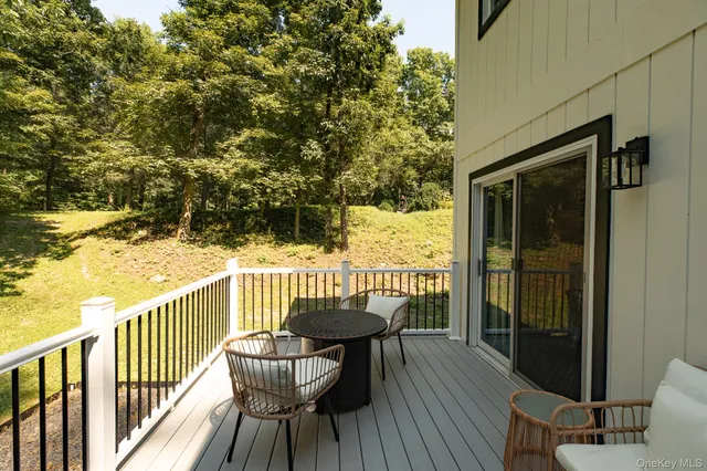 a view of a balcony with furniture