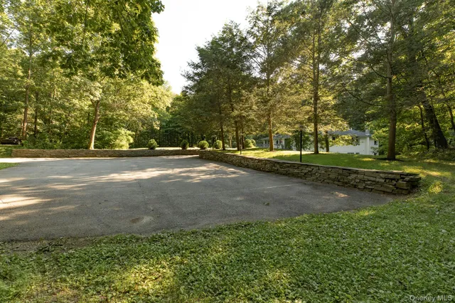 a view of a street with a yard