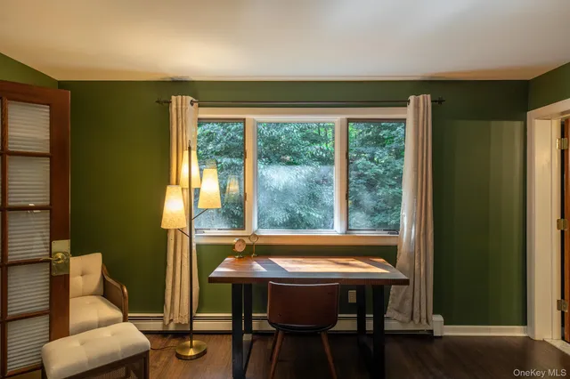 a view of a room with furniture and a window