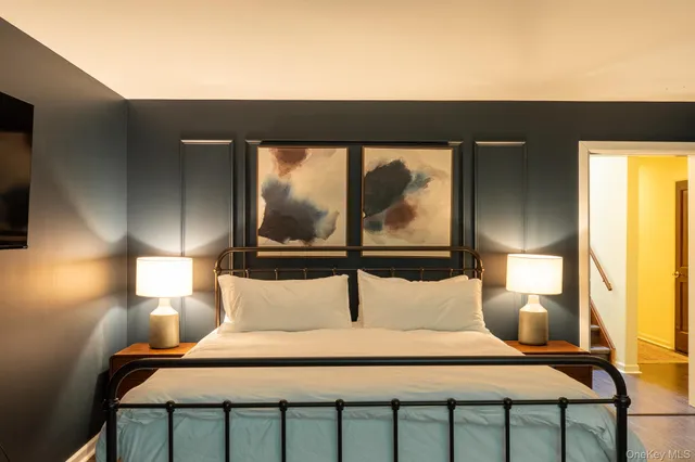 a bedroom with a bed and window