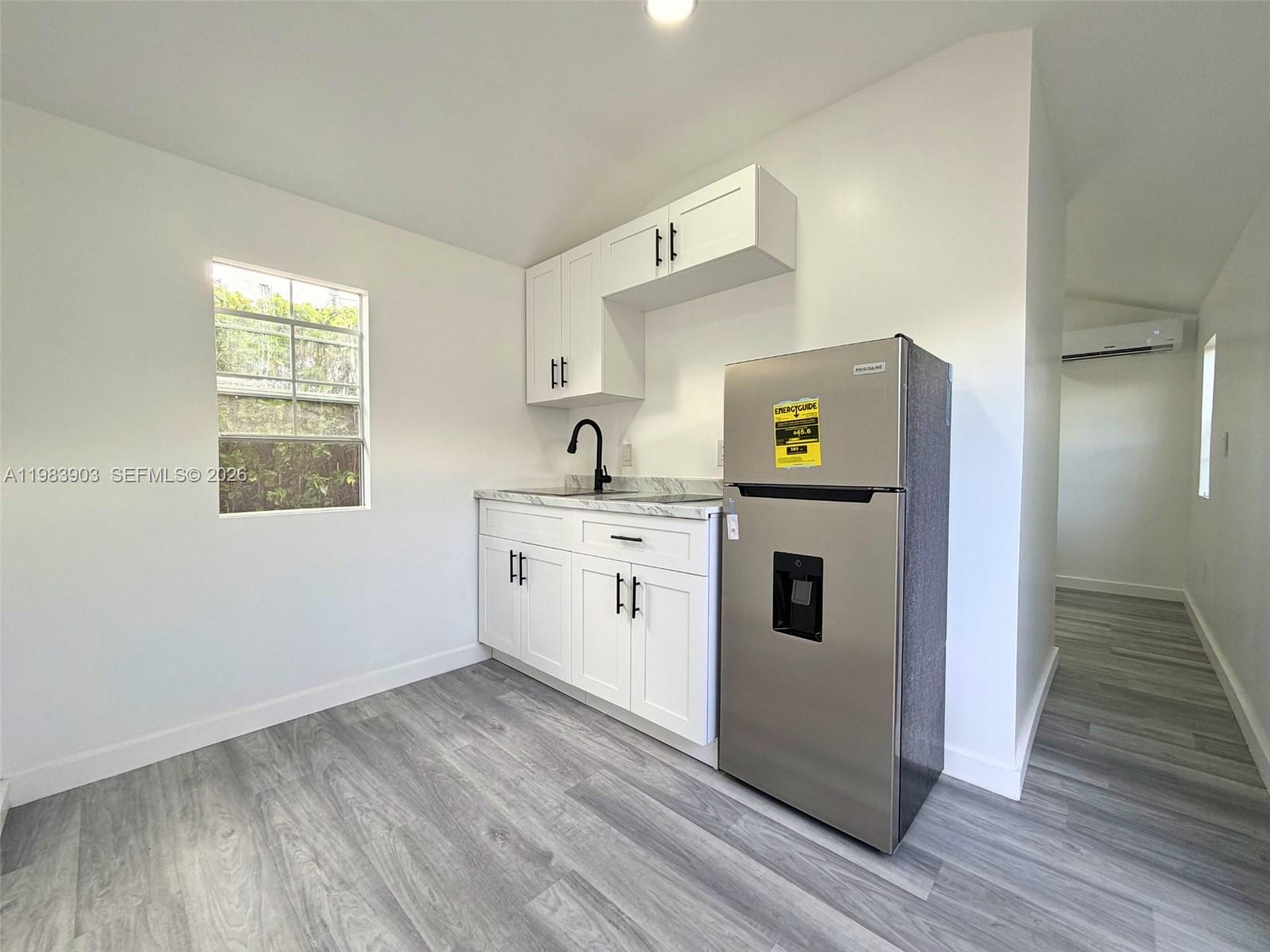 9255 Southwest 43rd Terrace Miami, FL 33165 - Photo 11 of 21 a view of utility room with washer and dryer