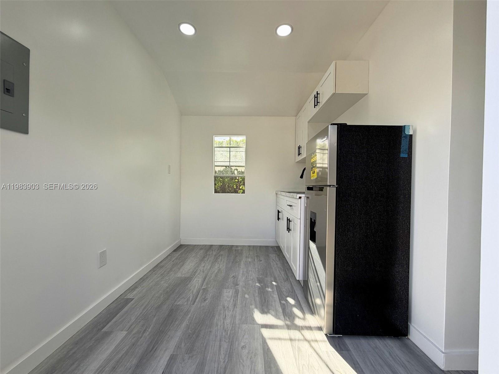 9255 Southwest 43rd Terrace Miami, FL 33165 - Photo 12 of 21 an empty room with windows and entrance