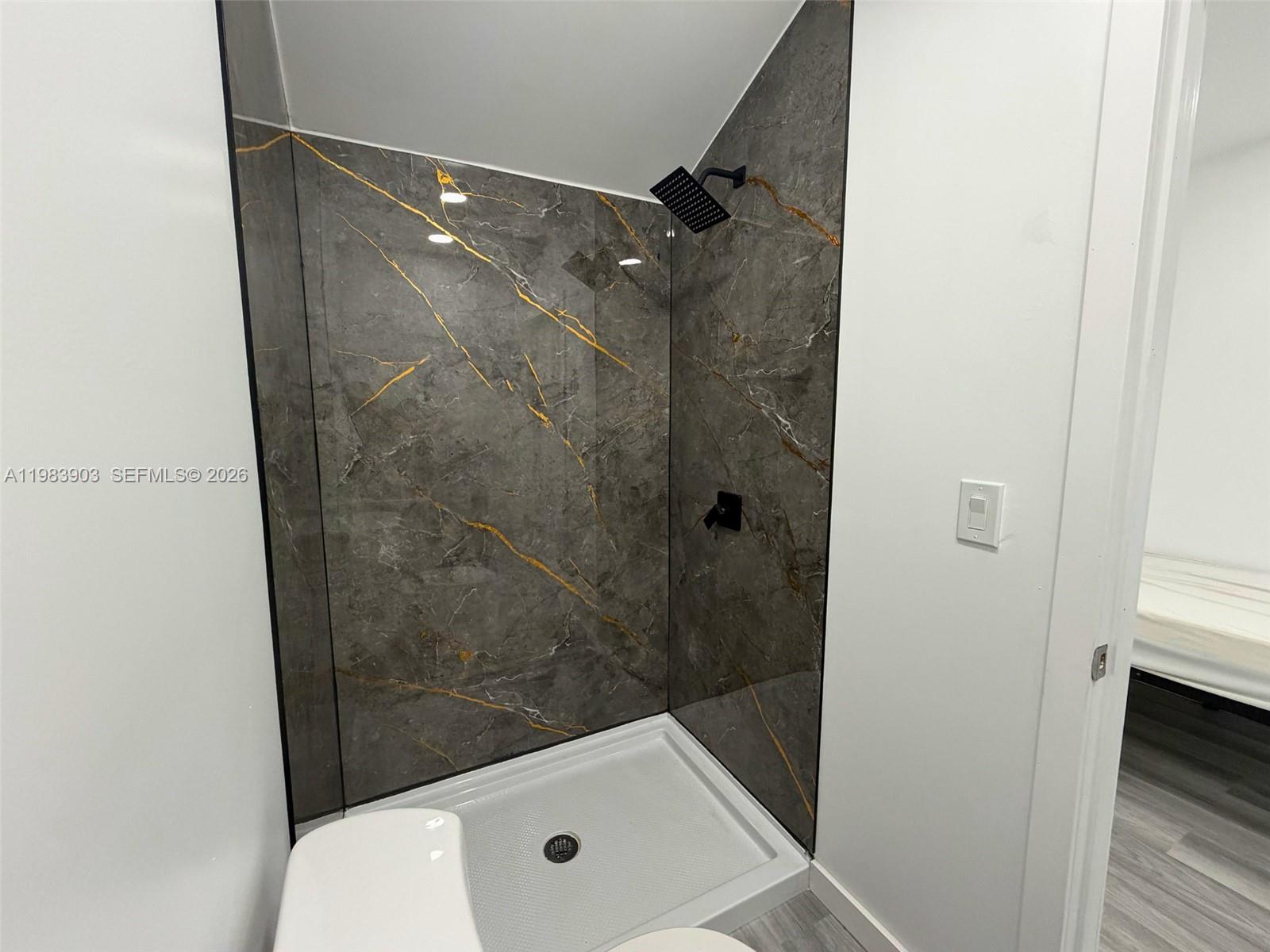 9255 Southwest 43rd Terrace Miami, FL 33165 - Photo 15 of 21 a bathroom with a tub and shower