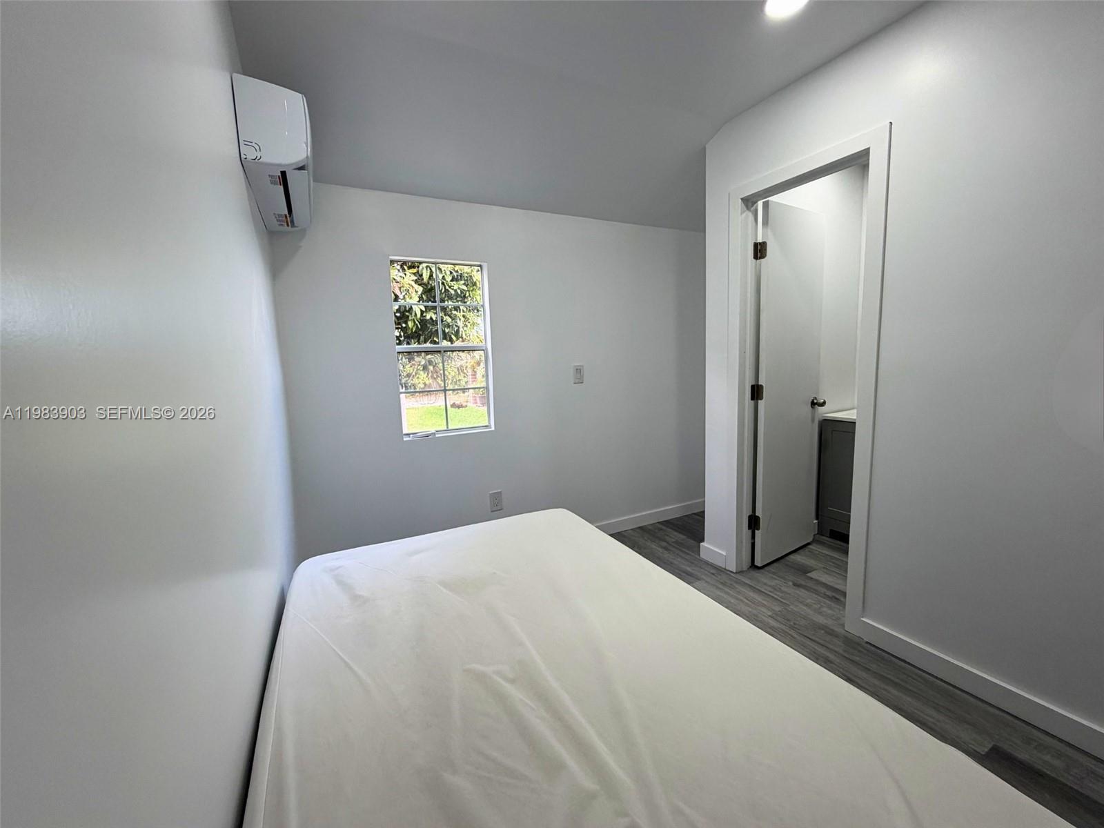 9255 Southwest 43rd Terrace Miami, FL 33165 - Photo 17 of 21 a bedroom with a bed and a window
