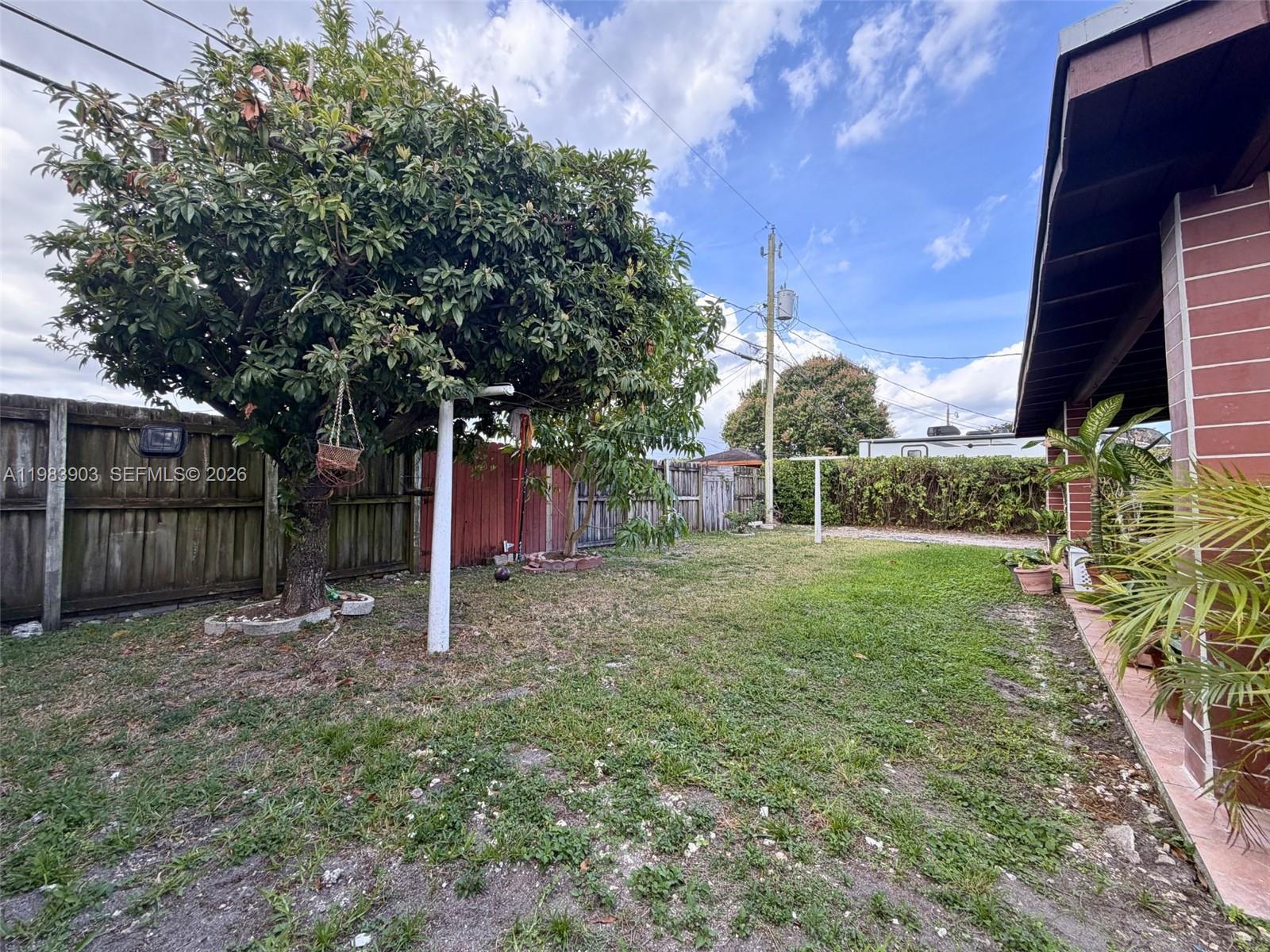 9255 Southwest 43rd Terrace Miami, FL 33165 - Photo 18 of 21 a view of a backyard