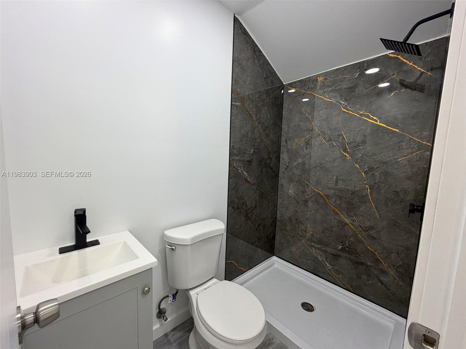 9255 Southwest 43rd Terrace Miami, FL 33165 - Photo 2 of 21 a bathroom with a toilet and a sink