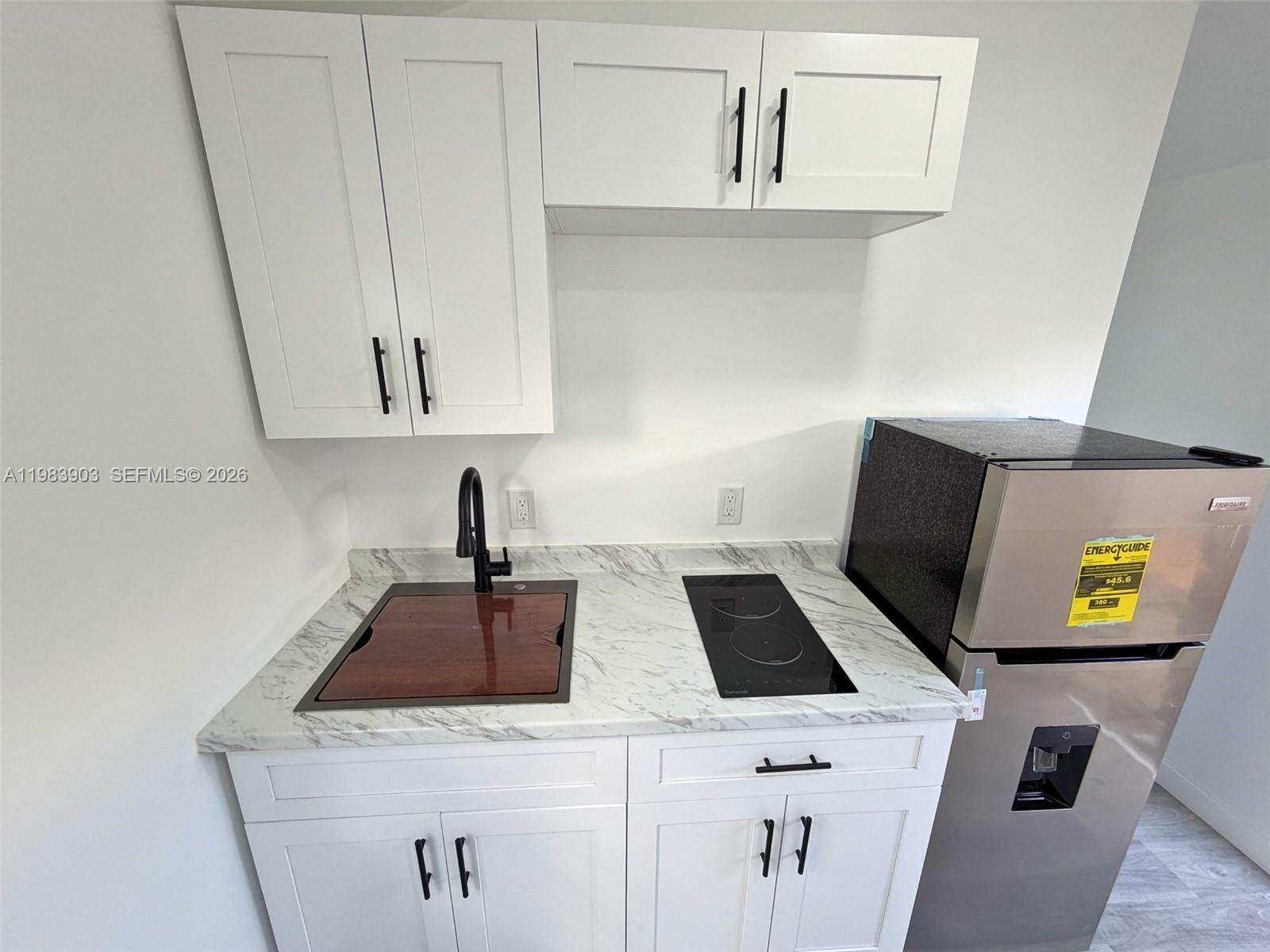 9255 Southwest 43rd Terrace Miami, FL 33165 - Photo 3 of 21 a view of kitchen island with sink