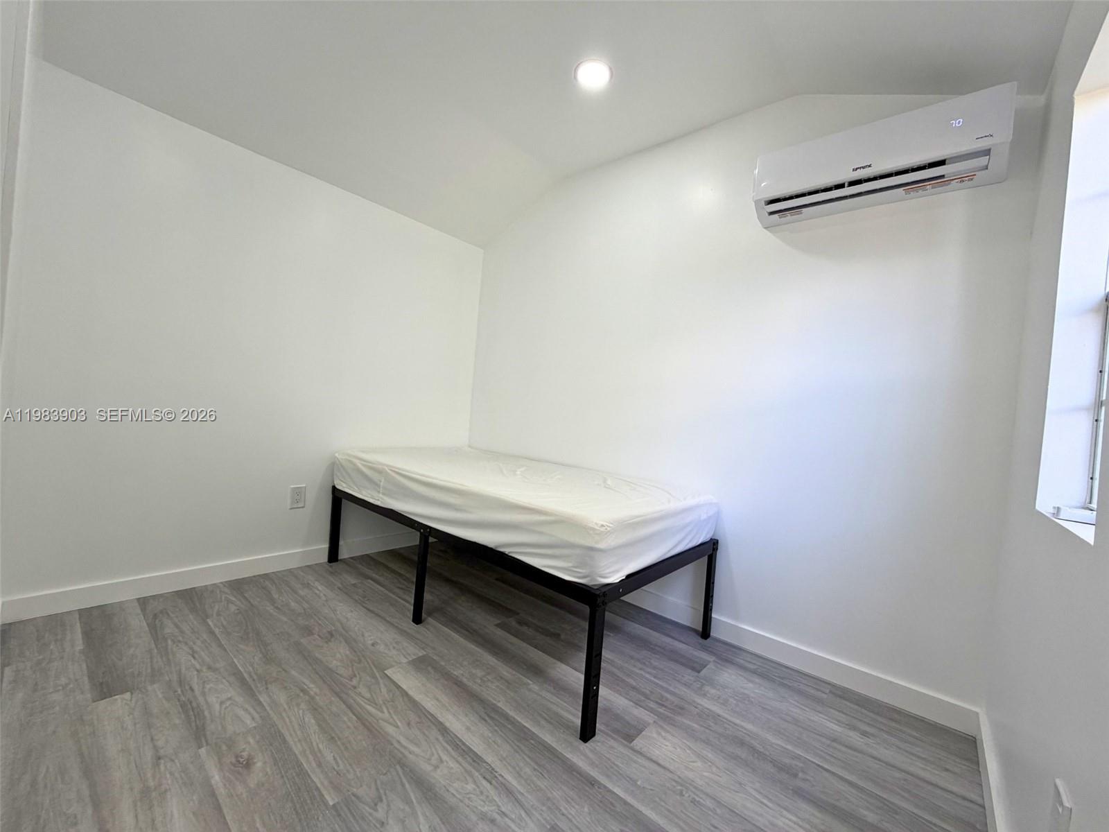 9255 Southwest 43rd Terrace Miami, FL 33165 - Photo 4 of 21 a view of a room with wooden floor and fan