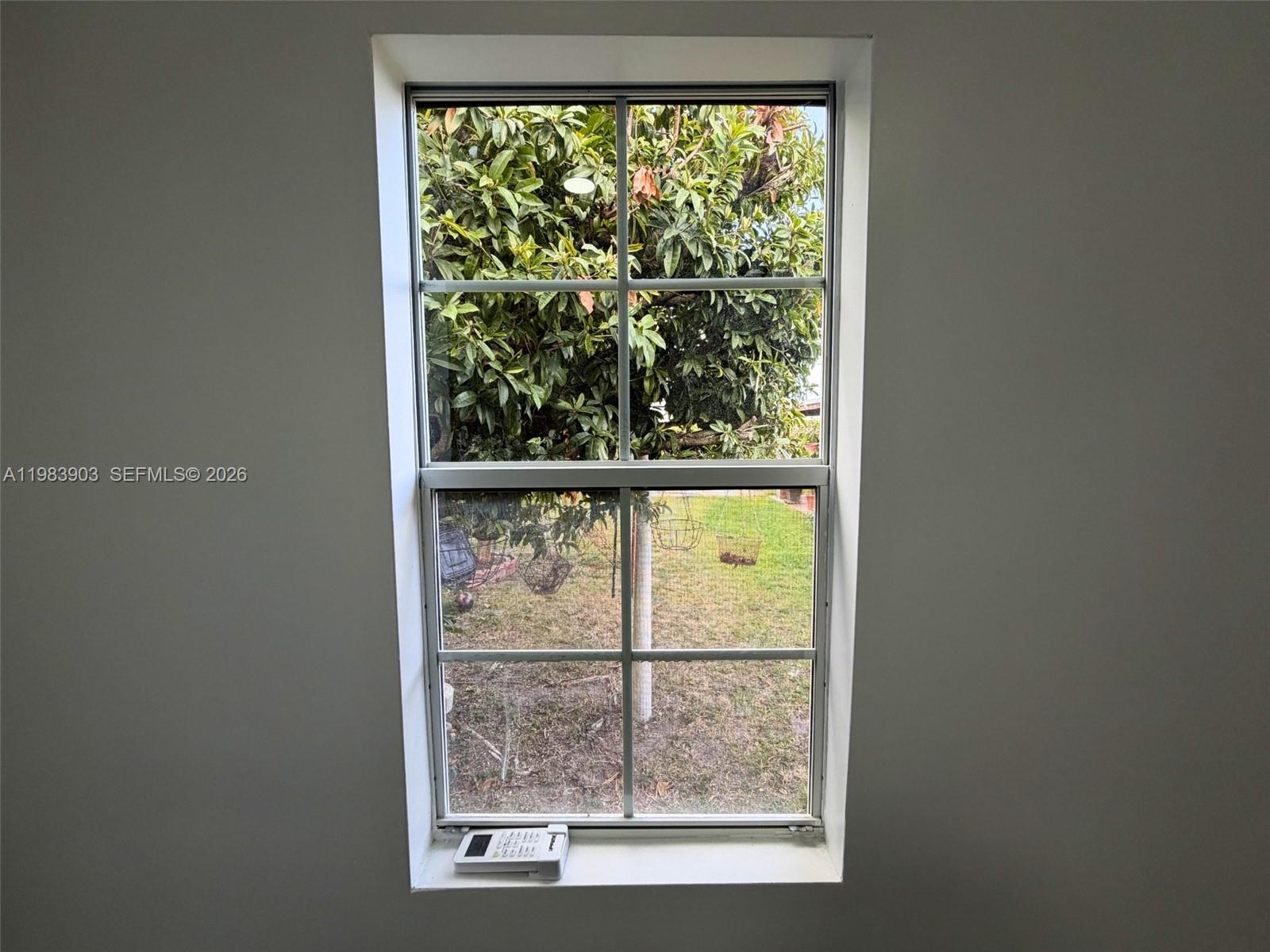 9255 Southwest 43rd Terrace Miami, FL 33165 - Photo 5 of 21 a view of a room that has a window in it