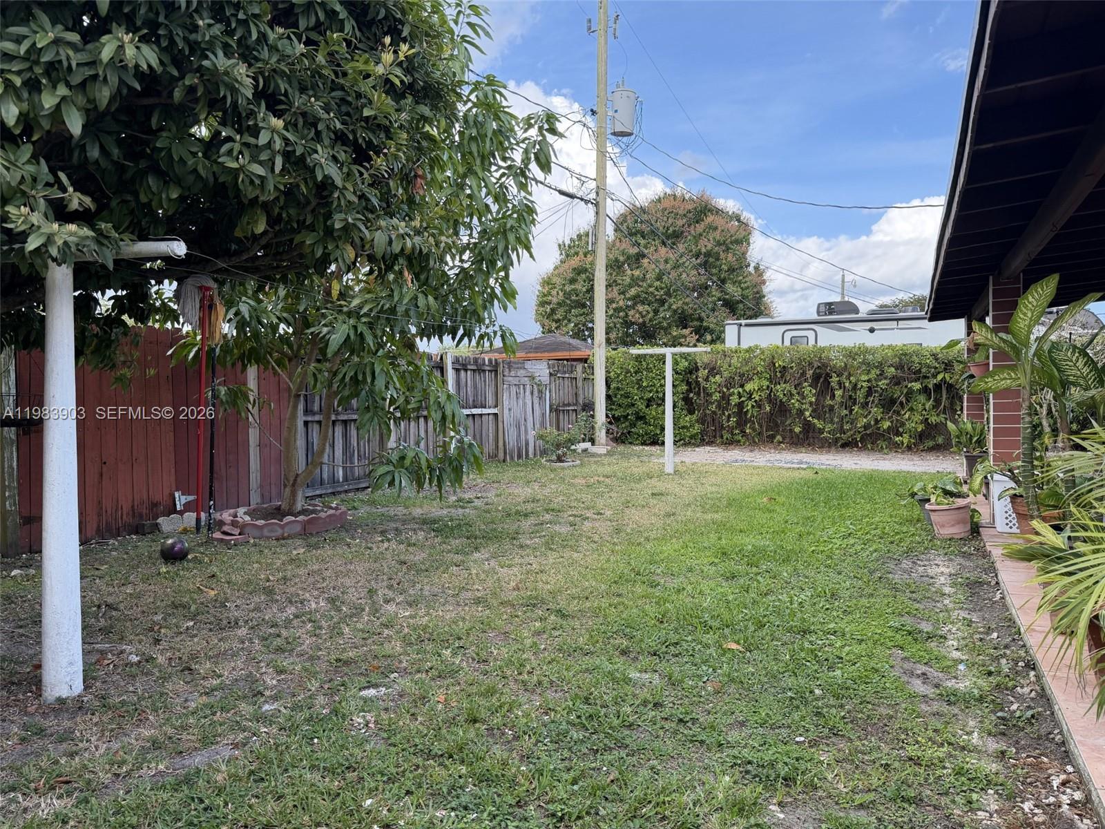9255 Southwest 43rd Terrace Miami, FL 33165 - Photo 8 of 21 a backyard of a house with lots of green space