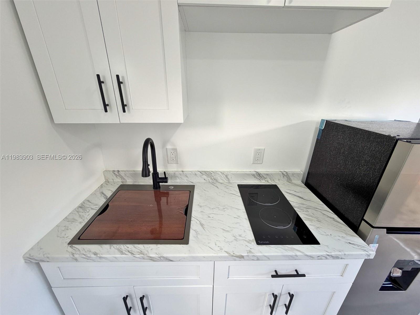 9255 Southwest 43rd Terrace Miami, FL 33165 - Photo 9 of 21 a close view of sink and tap