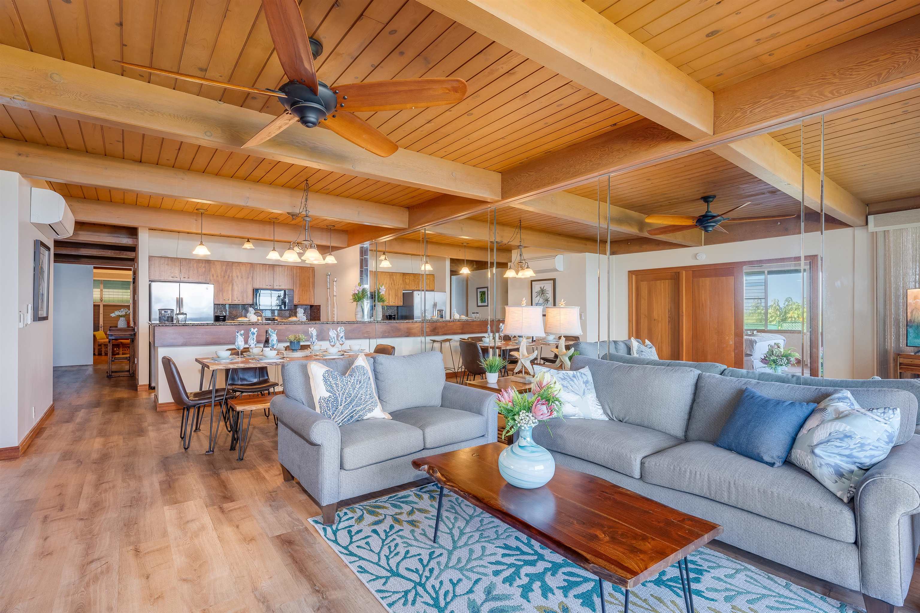 4521 Lower Honoapiilani Road, Unit 3A2 Lahaina, HI 96761 - Photo 13 of 37 a living room with furniture and a large window