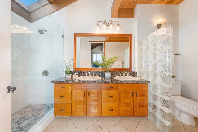 a bathroom with a sink a vanity and a mirror