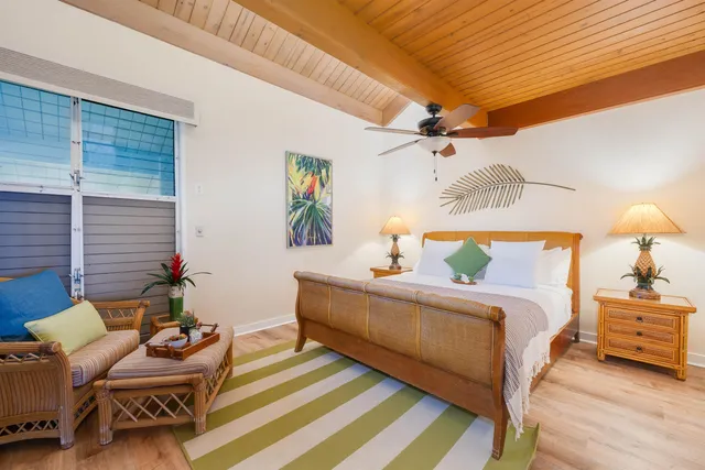 a bedroom with bed and a chandelier