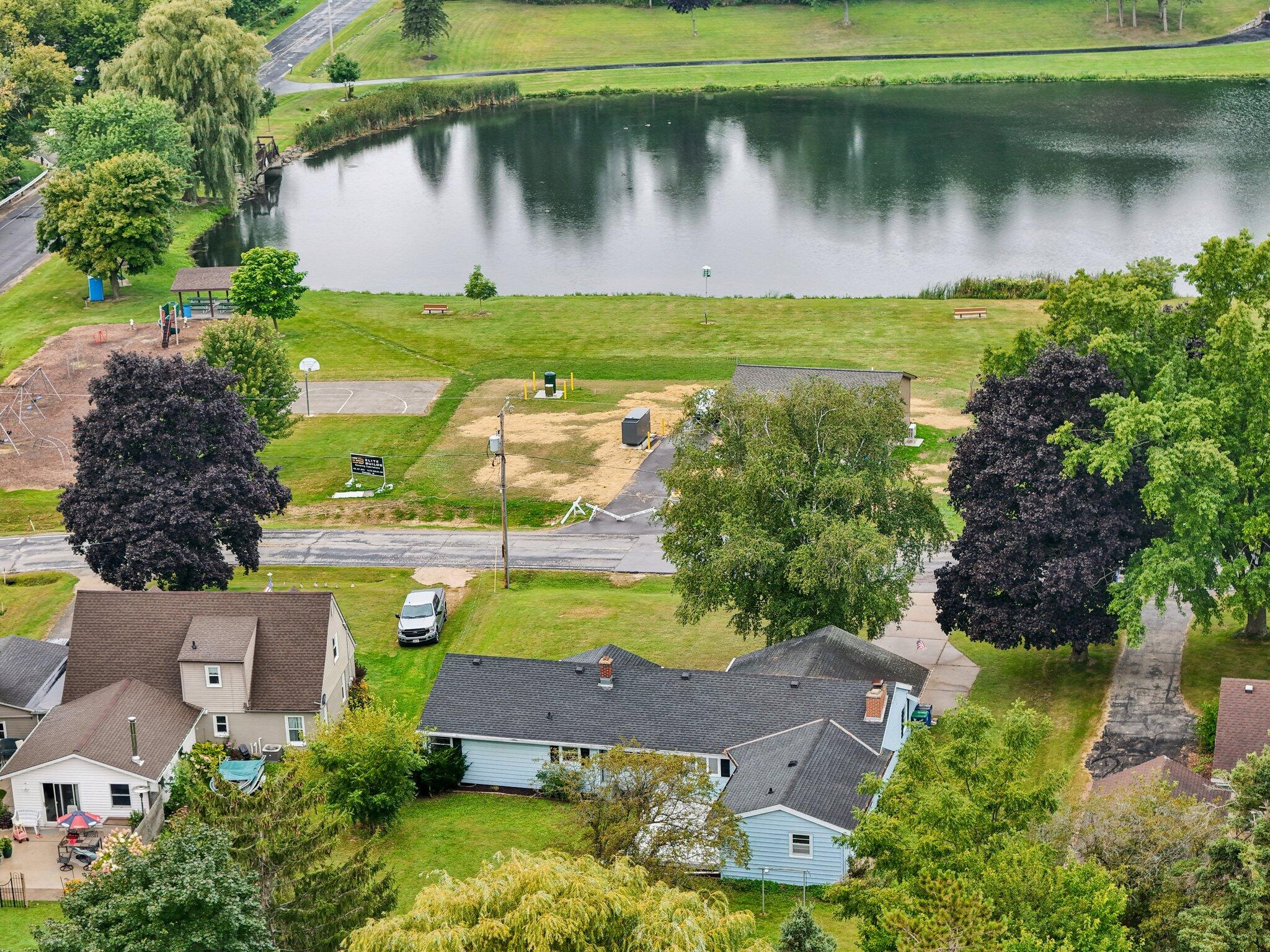 543 Clark Street Cascade, WI 53011 - Photo 20 of 24 Get your pole and go fishing ... or ... push the kids on the swing.