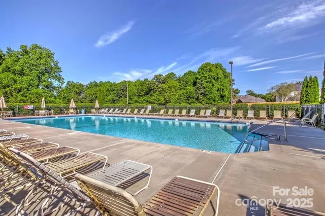 a view of swimming pool with outdoor space and seating area