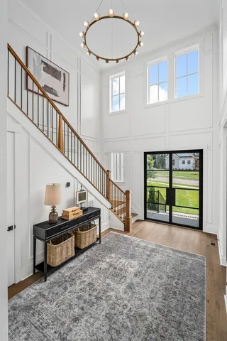 a living room with furniture a fireplace and a large window