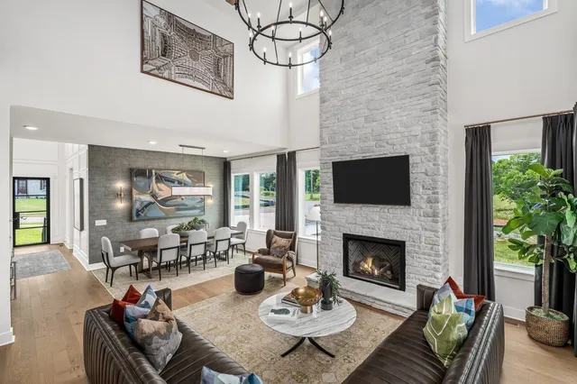 a kitchen with a table chairs sink and cabinets