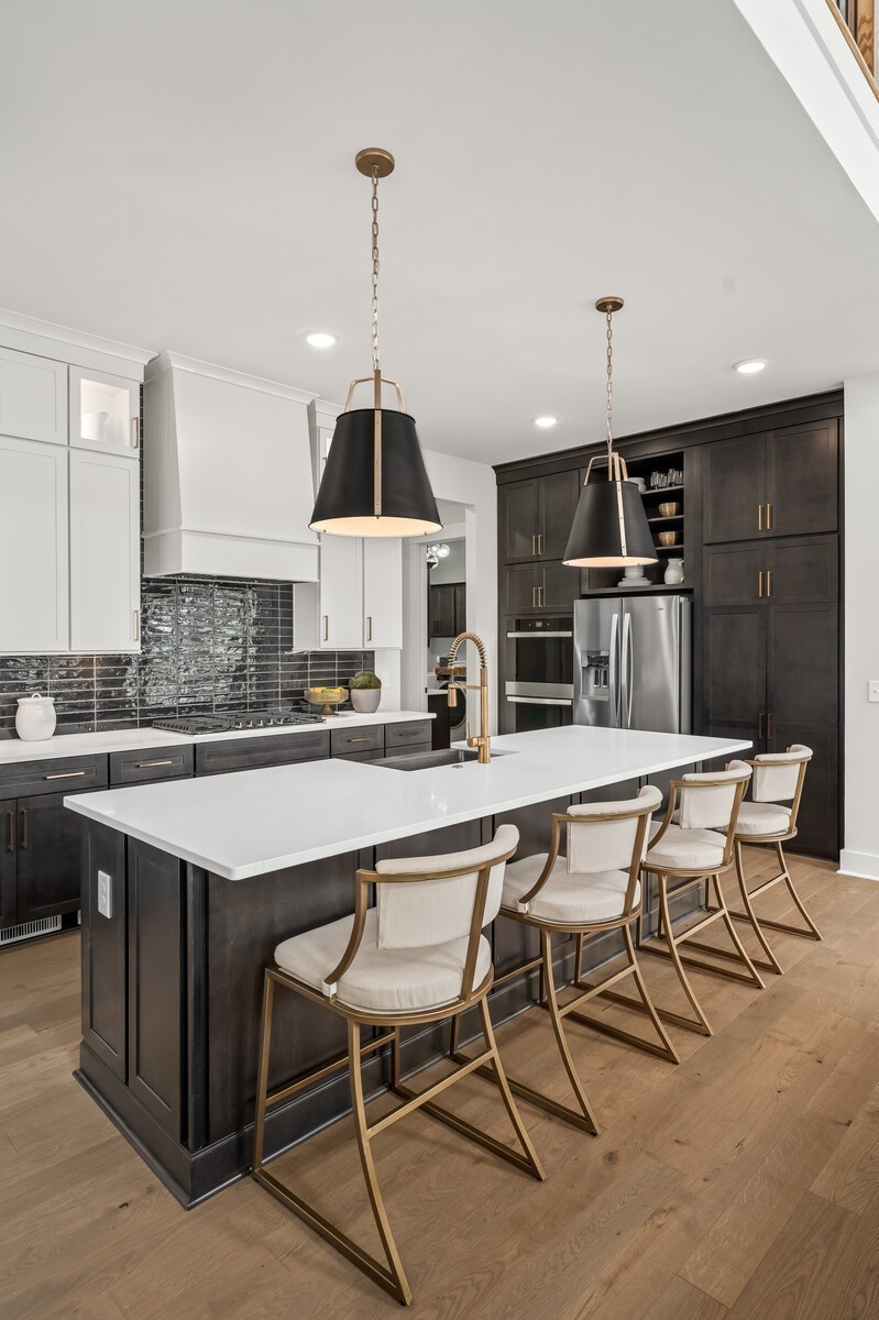 7221 Severide Street Fairview, TN 37062 - Photo 25 of 96 a kitchen with a table chairs sink and cabinets
