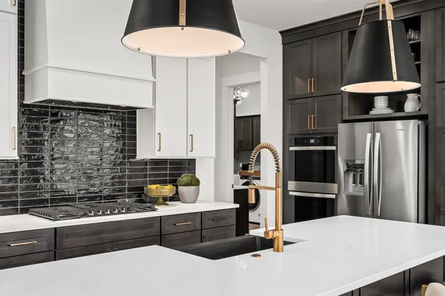 a white bath tub sitting next to a white sink