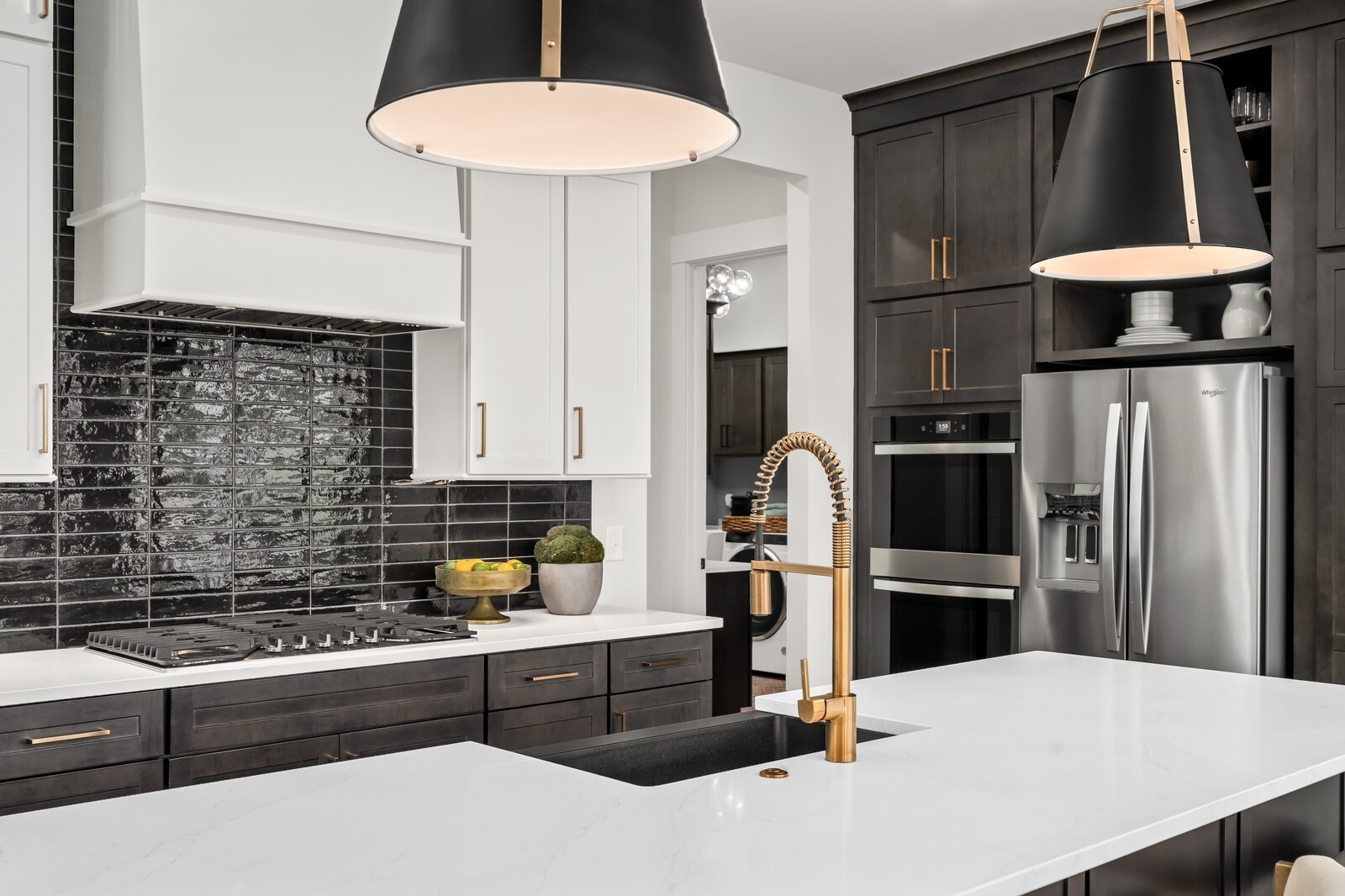 7221 Severide Street Fairview, TN 37062 - Photo 28 of 96 a kitchen with stainless steel appliances kitchen island granite countertop a refrigerator a sink and white cabinets