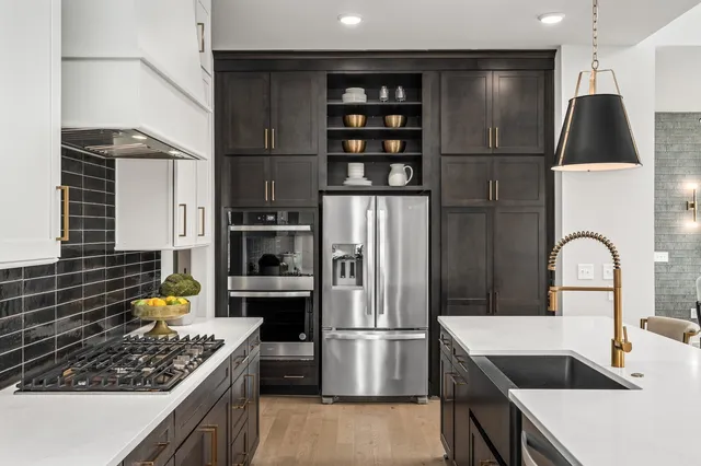 a utility room with sink dryer and washer