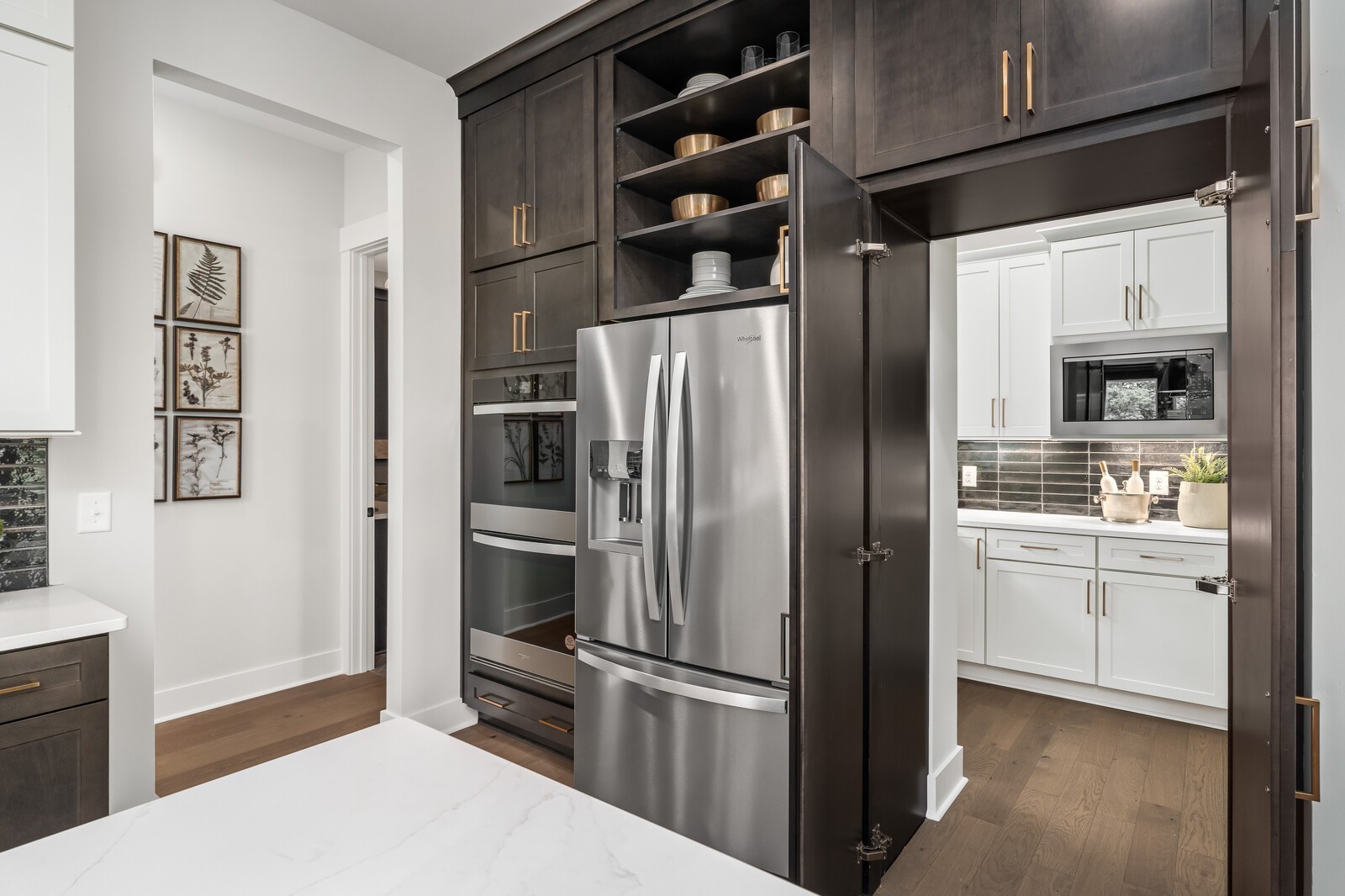 7221 Severide Street Fairview, TN 37062 - Photo 35 of 96 a kitchen with stainless steel appliances a refrigerator and cabinets