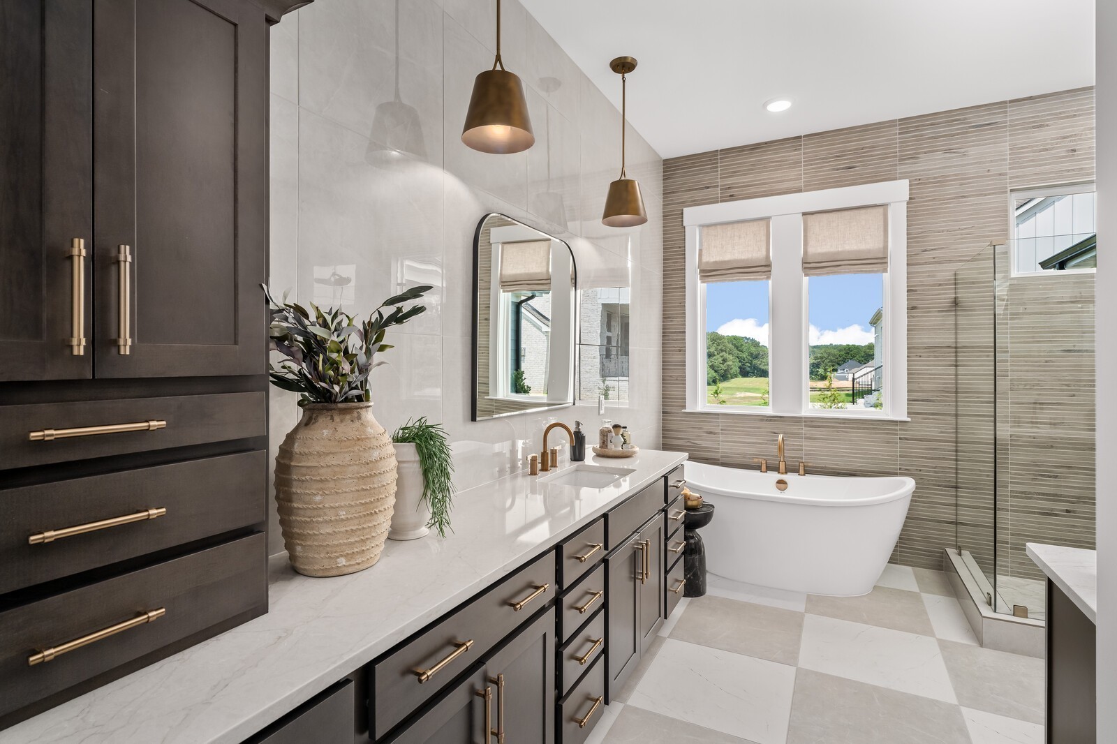 7221 Severide Street Fairview, TN 37062 - Photo 43 of 96 a bathroom with a two sinks a large mirror and a bathtub next to a window
