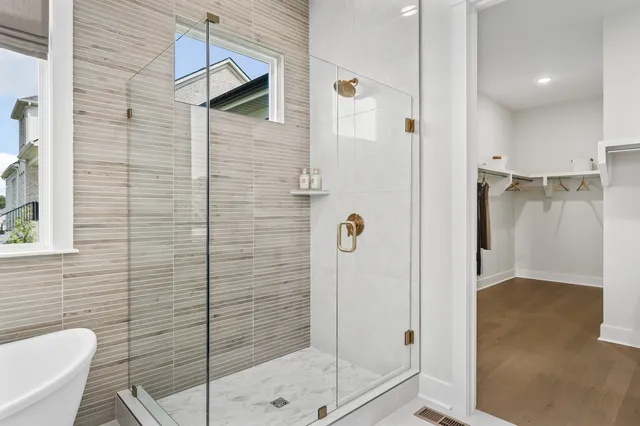 a front view of a house with garden and patio