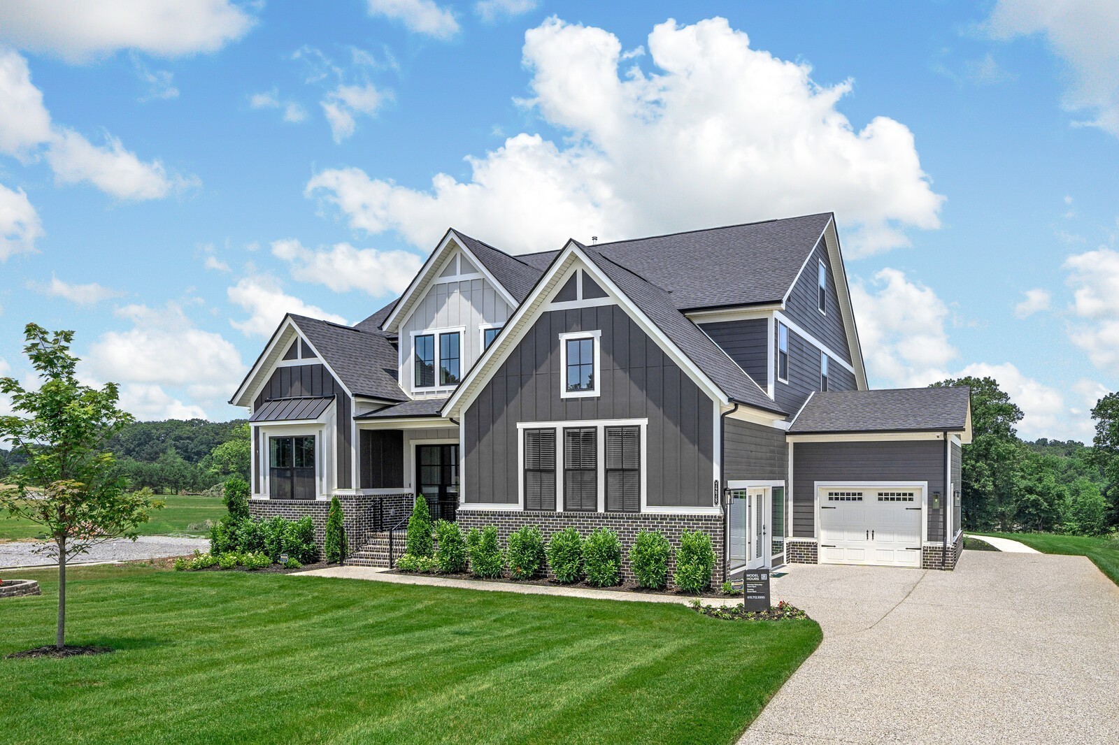 7221 Severide Street Fairview, TN 37062 - Photo 6 of 96 a front view of a house with a garden and plants