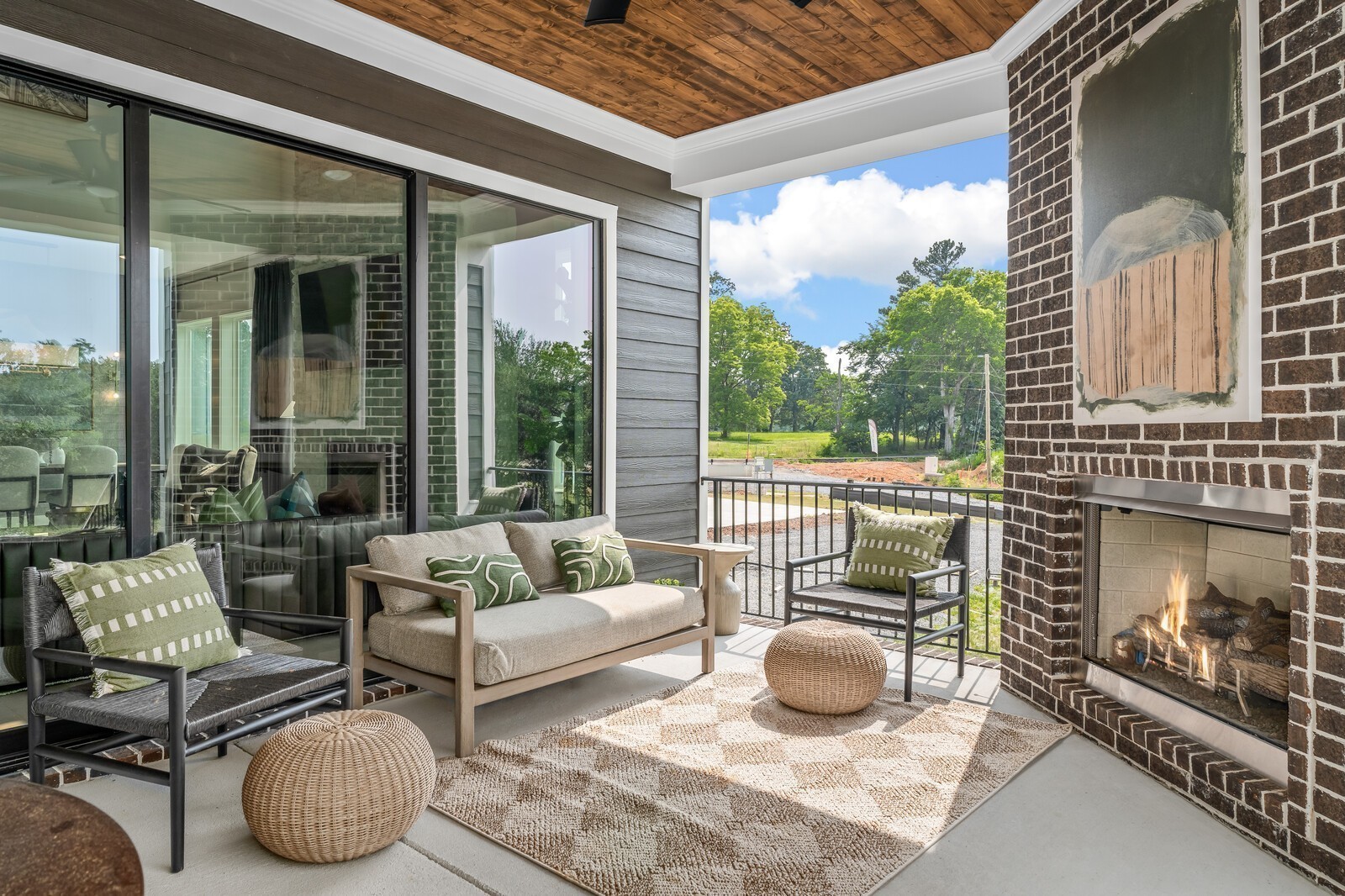 7221 Severide Street Fairview, TN 37062 - Photo 88 of 96 a living room with patio a fireplace and a floor to ceiling window