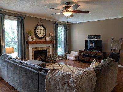 90 Faith-Rae Boulevard Morrison, TN 37357 - Photo 8 of 22 a living room with furniture a flat screen tv and a fireplace