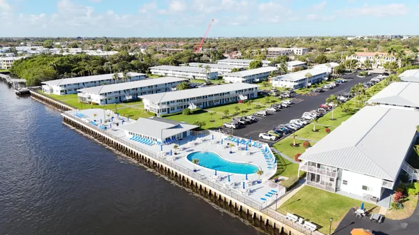 a swimming pool with outdoor seating and yard