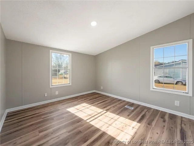 a view of an empty room and window
