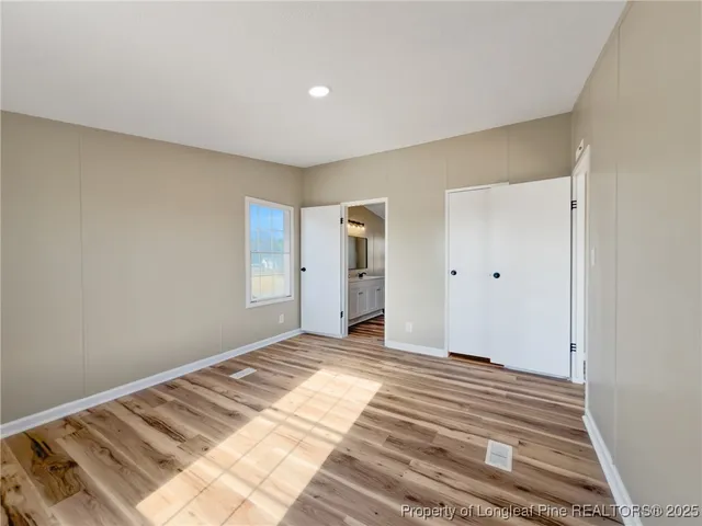 a view of a livingroom with wooden floor