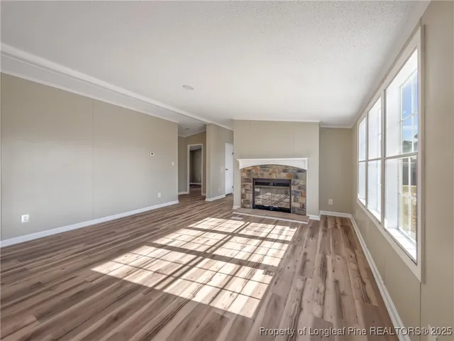 a view of an empty room and fire place