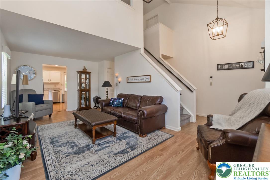 2314 Red Maple Drive Coplay, PA 18037 - Photo 10 of 73 Natural light illuminates this inviting living space featuring high ceilings and a view into the adjacent kitchen.