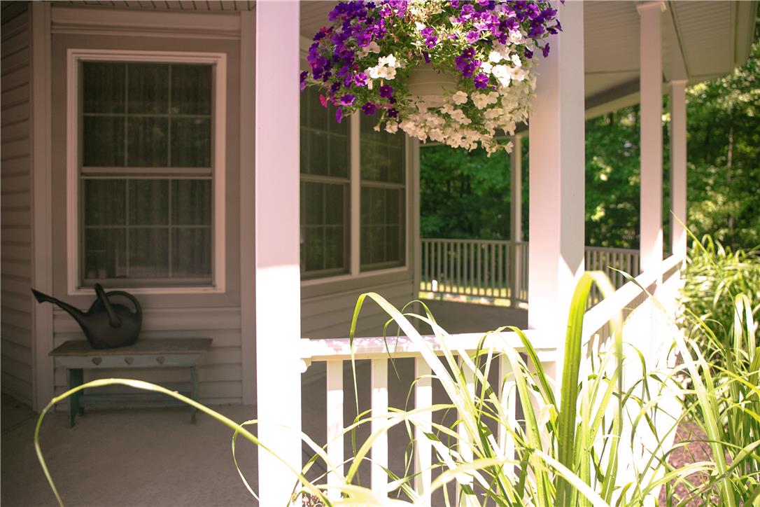 50 Anthony's Road White Haven, PA 18661 - Photo 10 of 57 A welcoming front porch, adorned with hanging floral baskets, provides an inviting outdoor retreat.