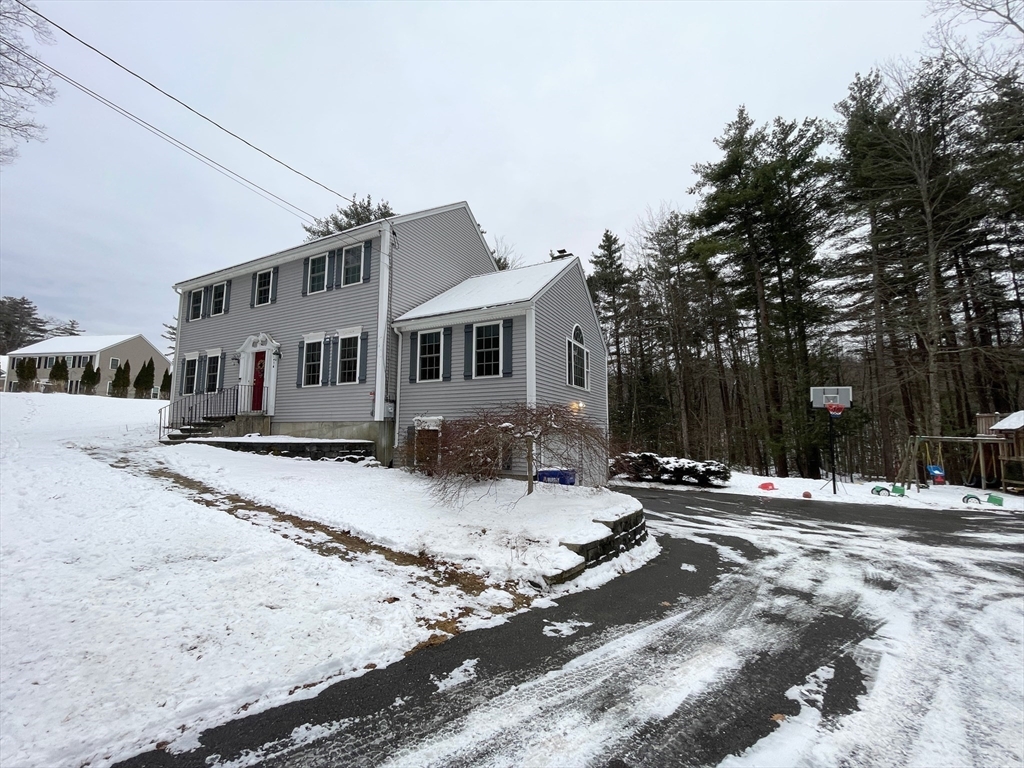 414 Piper Road Ashby, MA 01431 - Photo 4 of 34 a front view of a house with a yard