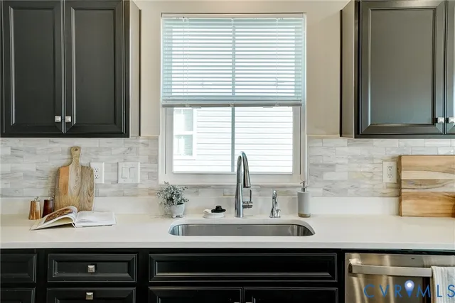 a kitchen with a sink and cabinets