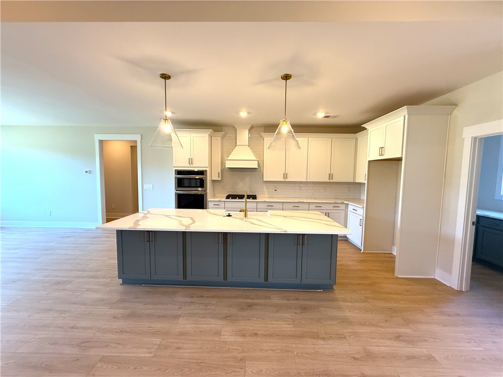 504 Tilman Court Anderson, SC 29621 - Photo 9 of 28 This spacious kitchen offers a large island with ample counter space, perfect for culinary endeavors.