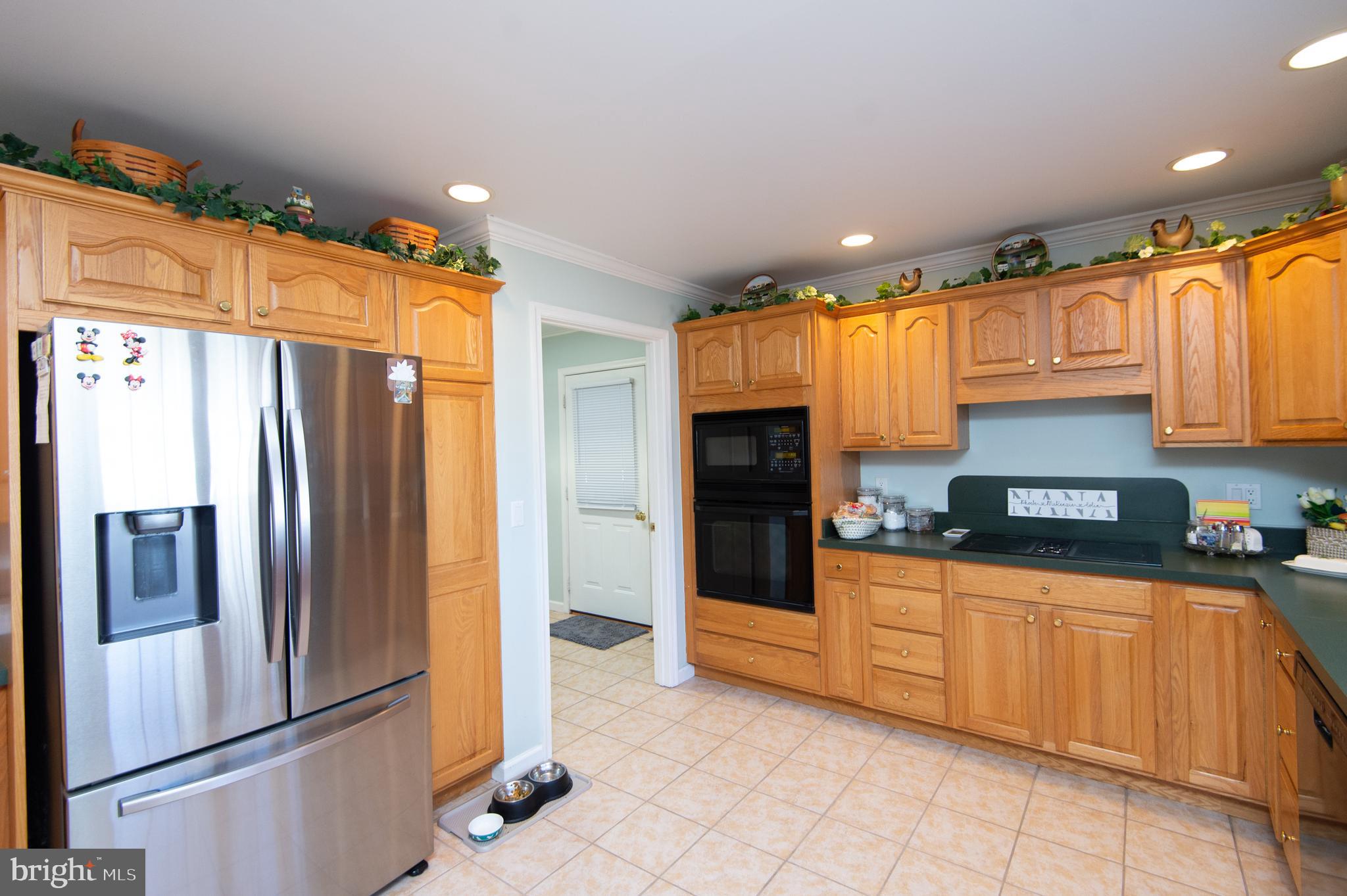 9 Holly Terrace Cambridge, MD 21613 - Photo 17 of 49 a kitchen with granite countertop a refrigerator and a sink